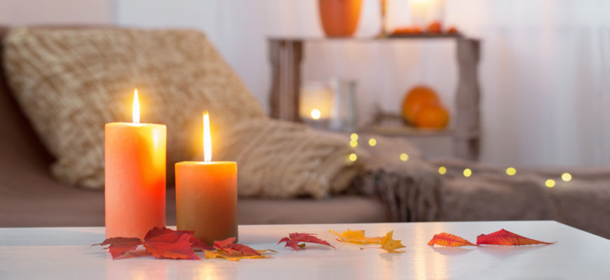 Burning,Candles,With,Autumn,Decor,On,White,Table,At,Home