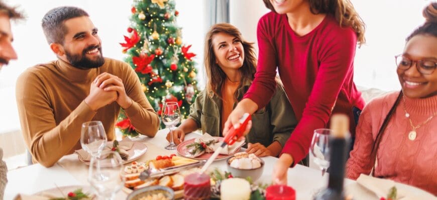 Group,Of,Cheerful,Friends,Celebrating,Christmas,Gathered,At,Home,,Woman